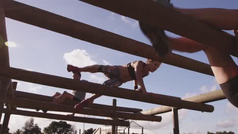 Young adults training at an outdoor gym bootcamp