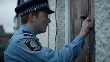 a police officer approaches a door with purpose, knocking intently, likely delivering an important message as the scene evokes tension and anticipation