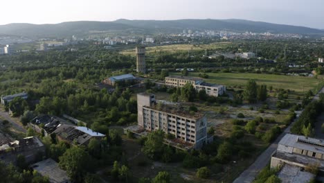 aerial reveal shot of closed chemical factory complex in bratislava, slovakia