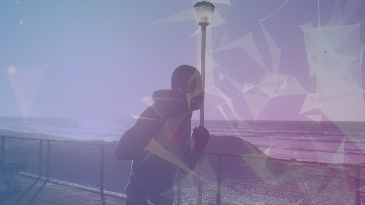 아프리카계 미국인 피트 남자가 산책로에서 달리면서 권투를 연습하는 것에 대한 플렉서스 네트워크