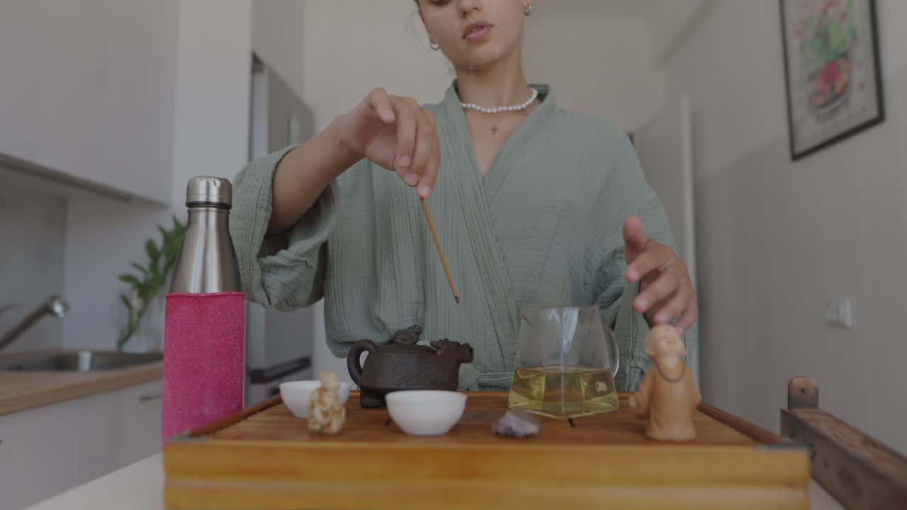Woman performing a tea ceremony