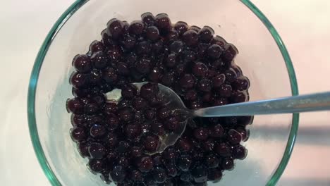 Asian-tapioca-balls-also-known-as-boba-pearls-on-a-white-background