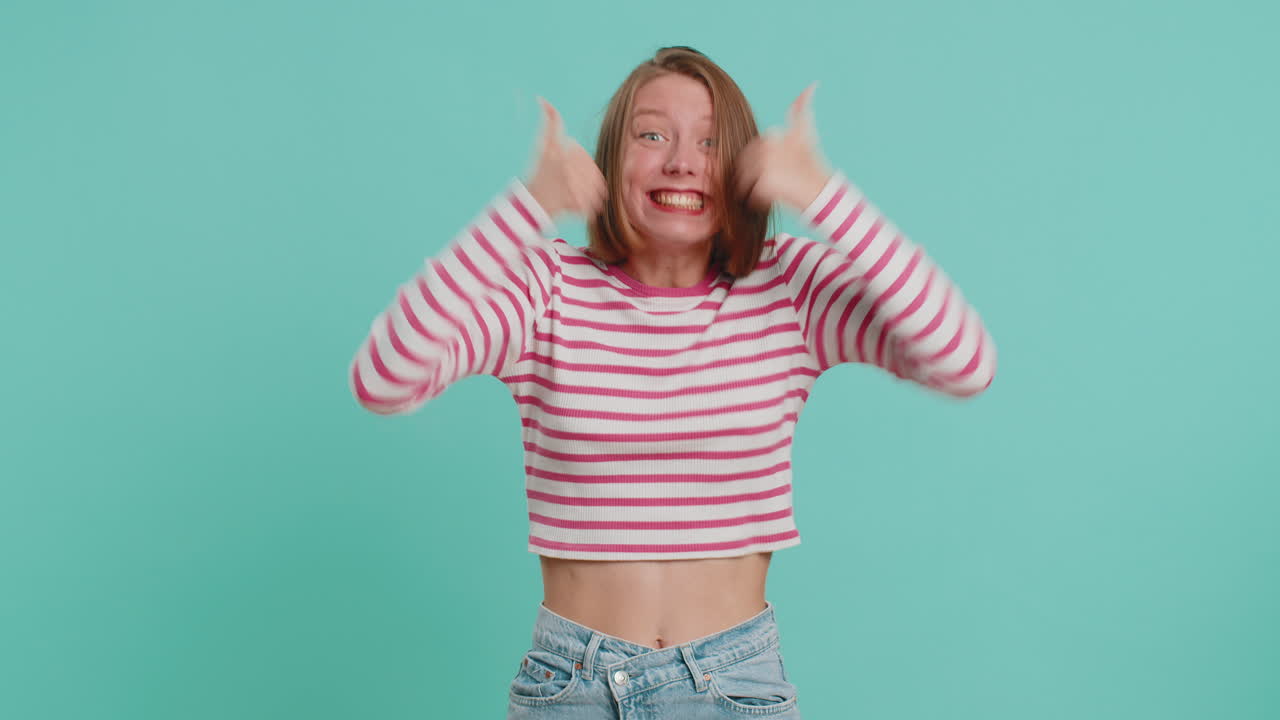 Happy young woman celebrating success winning birthday lottery jackpot goal achievemen good news