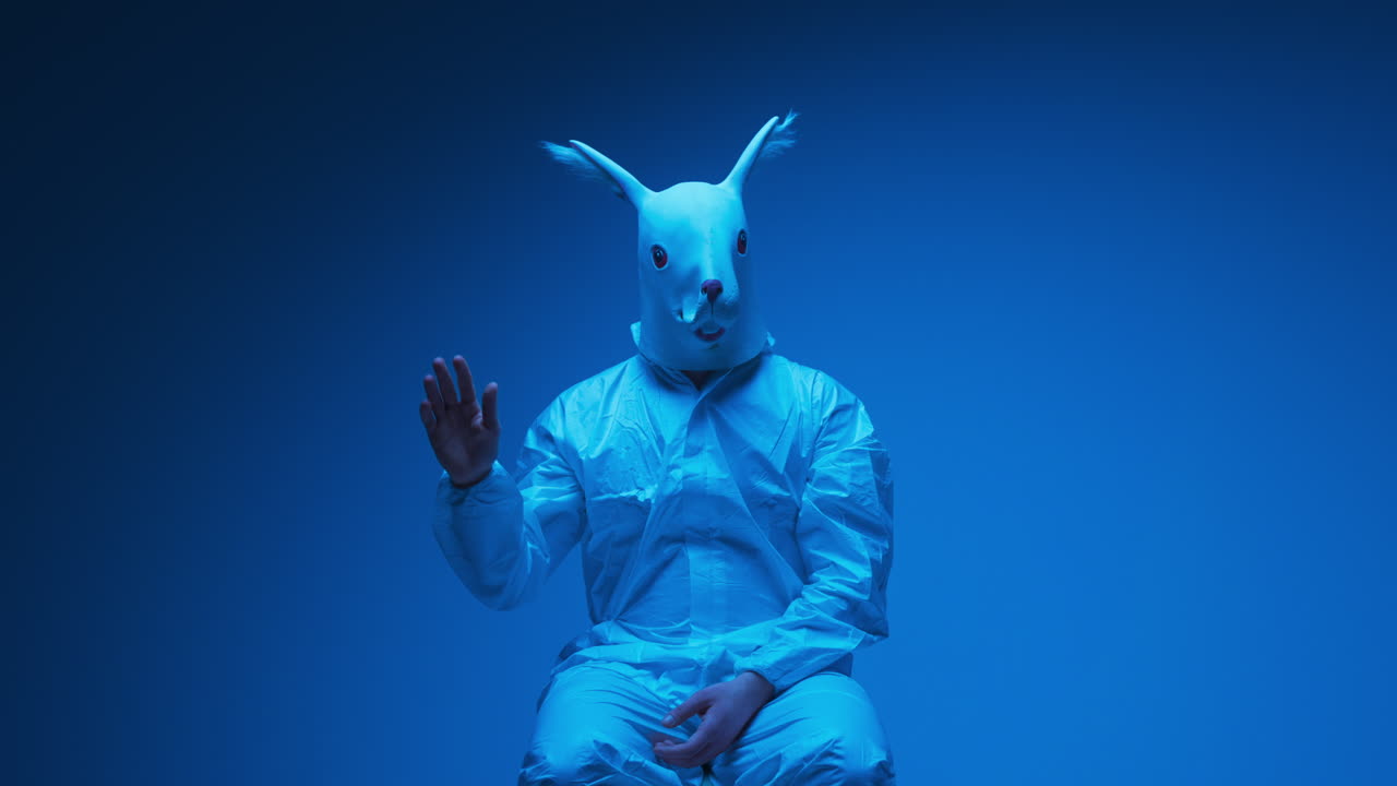 Person in Rabbit Mask and Protective Suit