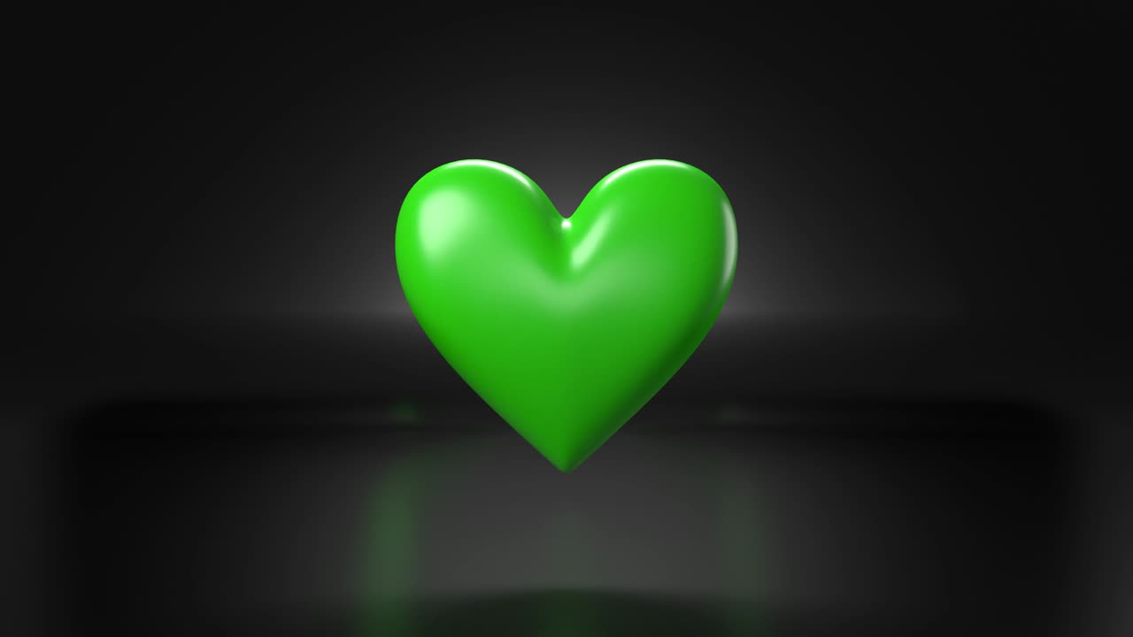 검은색 배경에 박동하는 녹색 심장 모양의 물체.