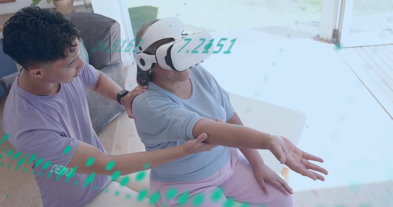 Man adjusting headset and guiding senior's arm on sofa, green particles around headset for therapy