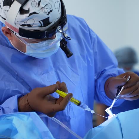 in surgery. medical team performing operation in hospital operating theater. working with surgical instruments