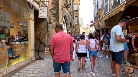 people walking and shopping in a quaint street