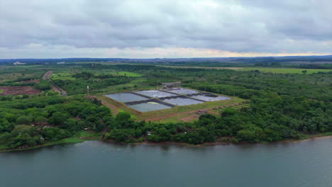 aerial view of a waste solids treatment plant near a river. environmental regulations. argentina.