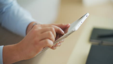 Close-Shot-of-Man-Working-on-Digital-Tablet