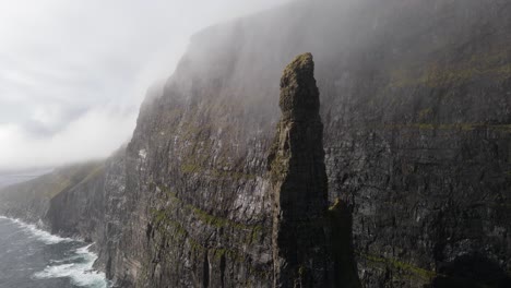 Circular-drone-footage-of-the-Witch-Finger-at-Sandavagur-on-the-Vagar-island-in-the-Faroe-Islands