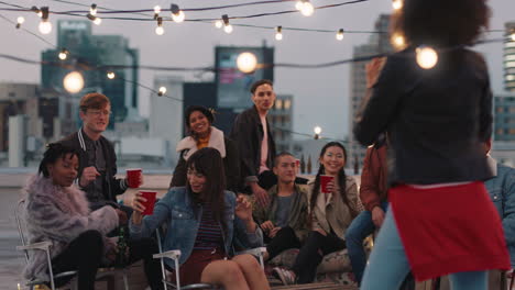 multi ethnic group of friends posing for photo on rooftop party at sunset students enjoying weekend gathering in urban city