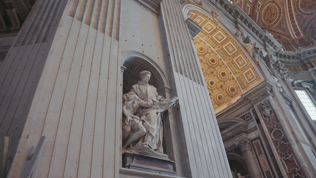 A stunning interior view of St. Peter’s Basilica in the Vatican, showcasing its ornate dome, marble statues, and golden Baroque details that reflect the grandeur of Renaissance art.