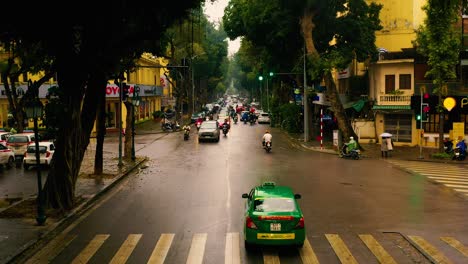 hanoi, vietnam - april, 2020: aerial panorama view of the traffic of the street in the city centre of hanoi in cloudy weather.