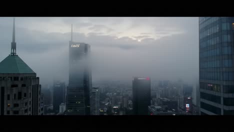 aerial view of a cityscape shrouded in misty fog, illuminated by fading light, capturing the ethereal beauty of urban architecture and skyline