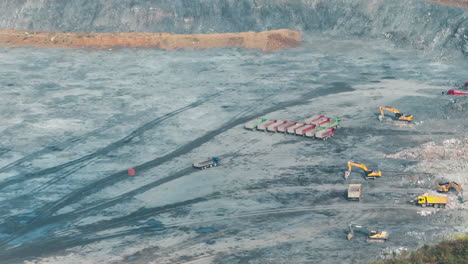 heavy coal mining truck activity operating in open pit coal mine quarry operation excavator developing the iron ore on the opencast mining site, large transport vehicle open pit mines, heavy machinery