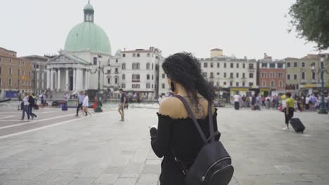 girl walking in a square in venice