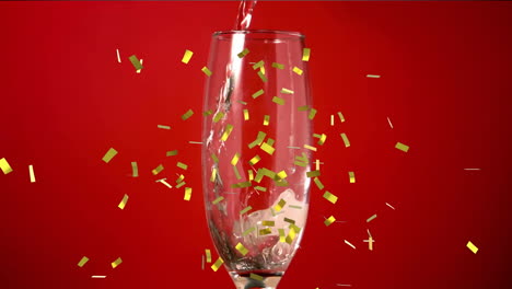 Animation-of-confetti-falling-over-champagne-glass