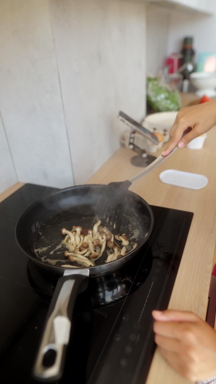 Frying Mushrooms in a Kitchen