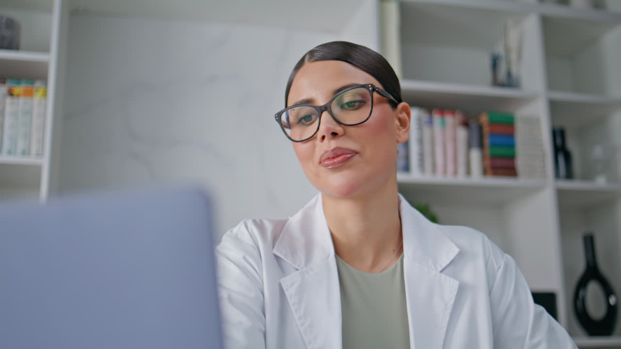 Positive physician video call in clinic office closeup. Laughing therapist