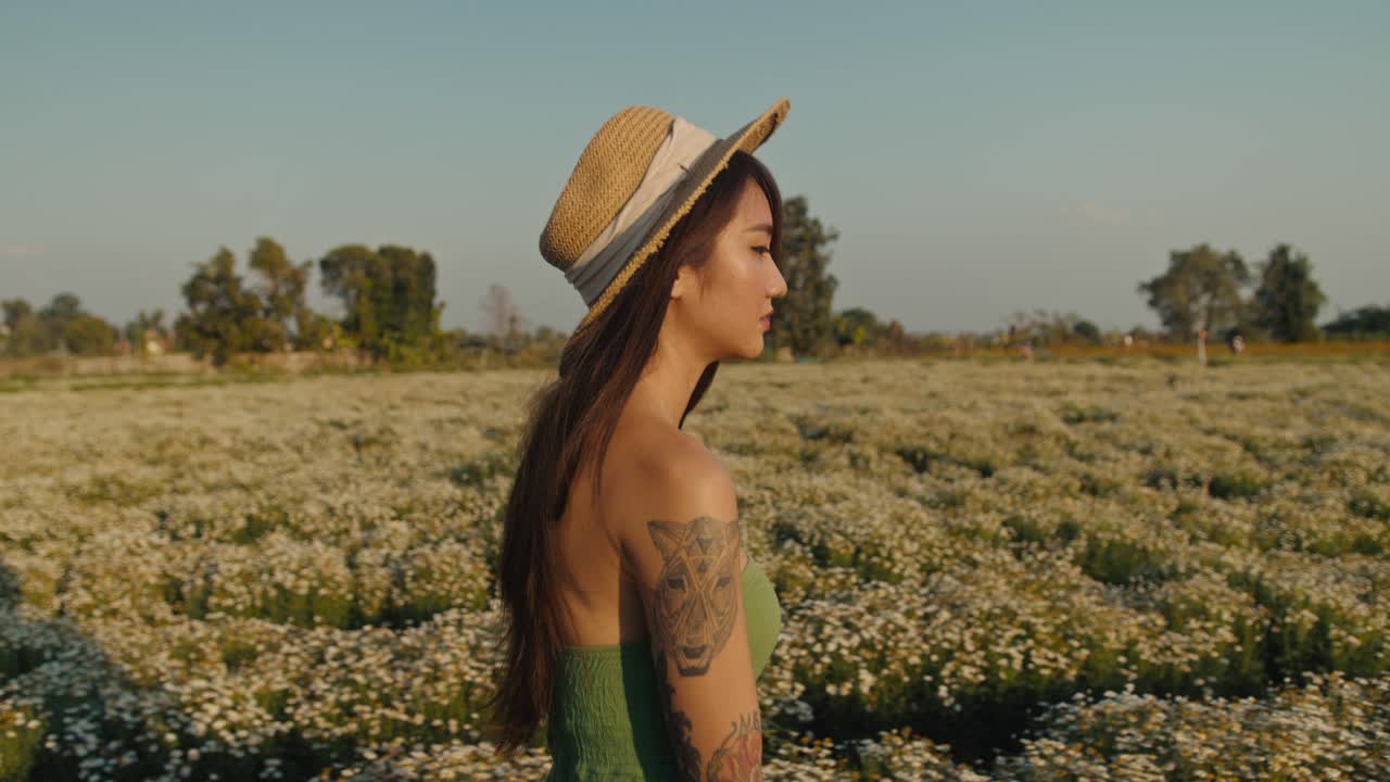 Woman in a field of daisies