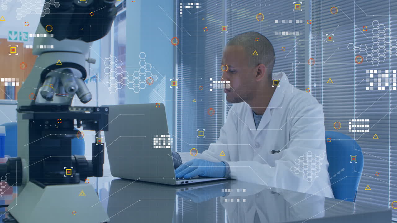 Animation of white pixels of processing data over biracial male scientist using laptop in laboratory