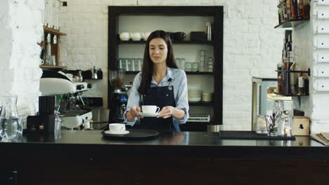 Cheerful-Waitrees-And-Waiter-Dancing-And-Having-Fun-While-Working-At-The-Bar