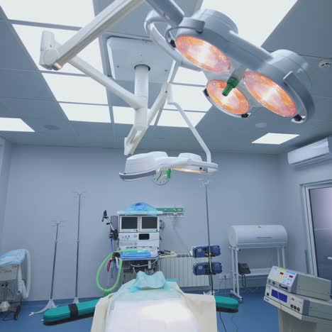 medical equipment in an empty surgical room. panoramic view of modern intensive care unit in hospital. healthcare concept