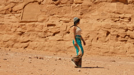 woman walking along the great temple of ramses ii of abu simbel