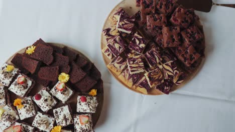 overhead view of brownies and black forest pastry (schwartswald cake) display at wedding dessert bar