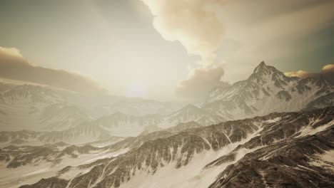 panorama of high snow mountains at sunset