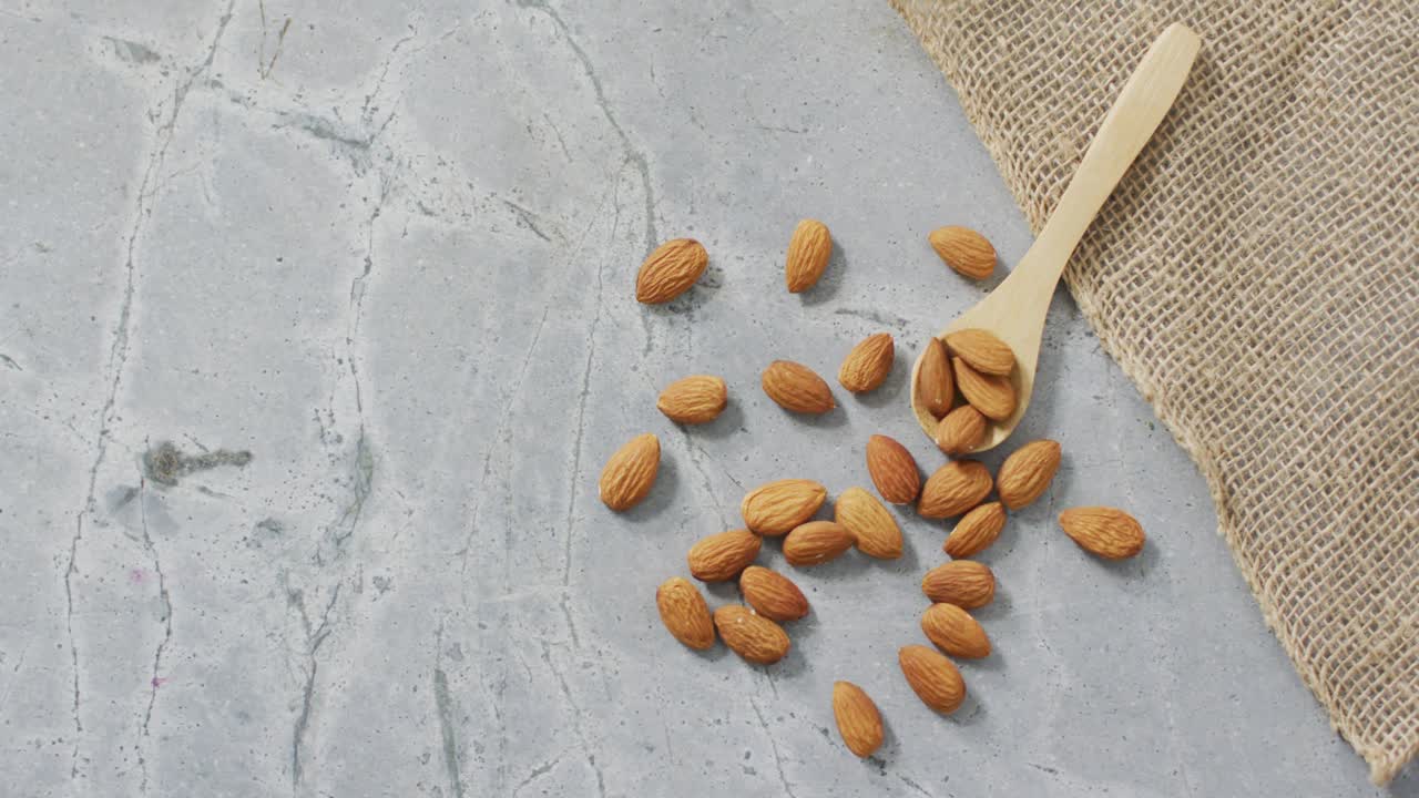 Video of almonds on stone background