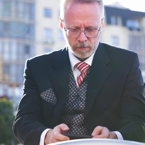 excited man play games by mobile phone
