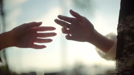 the hands of two people tend to touch one another, emotional love, togetherness, human relation, separation concept