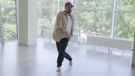 man breakdancing in modern studio