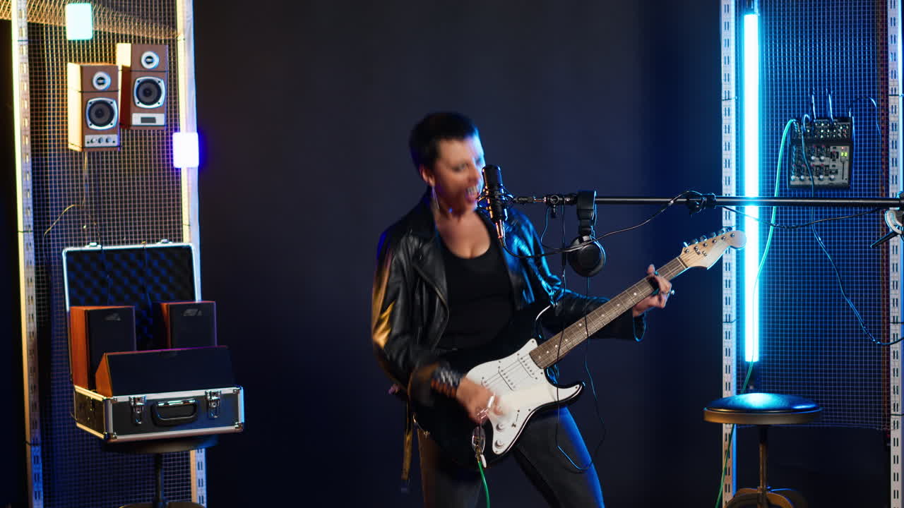 Female musician performing with electric guitar and microphone