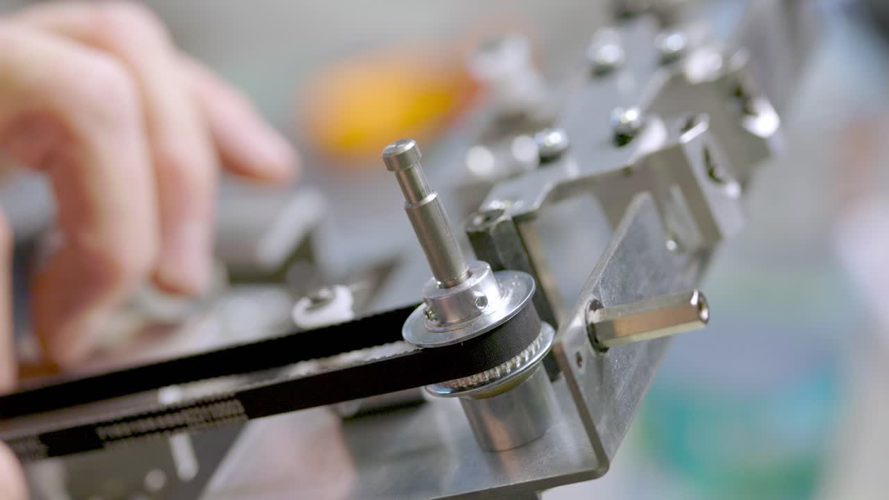 Testing a belt on a small pulley by hand