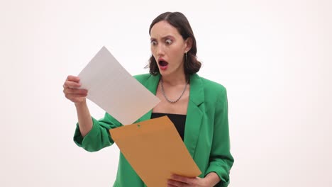 woman shocked by contents of an envelope