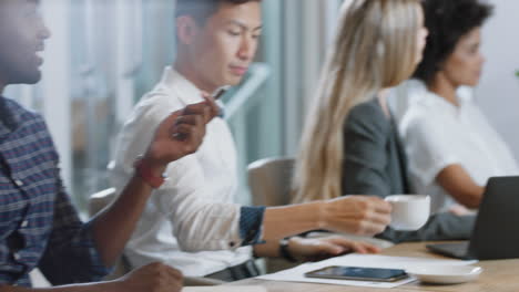 group-of-business-people-having-conference-call-meeting-in-boardroom-team-leader-man-chatting-to-colleagues-using-online-video-chat-on-tv-screen-discussing-ideas-in-office-4k