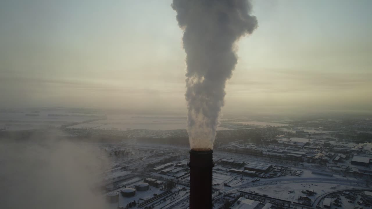 Industrial Power Plant with Smoke Stack in Winter