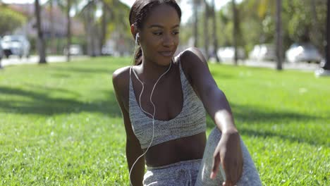 smiling woman in earphones