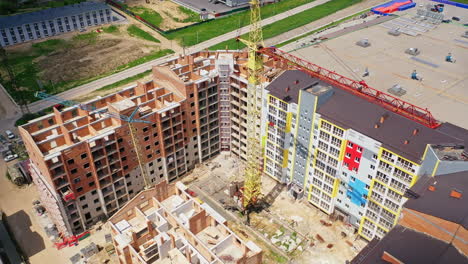 Construction site shot from above. Aerial view of new residential building under construction