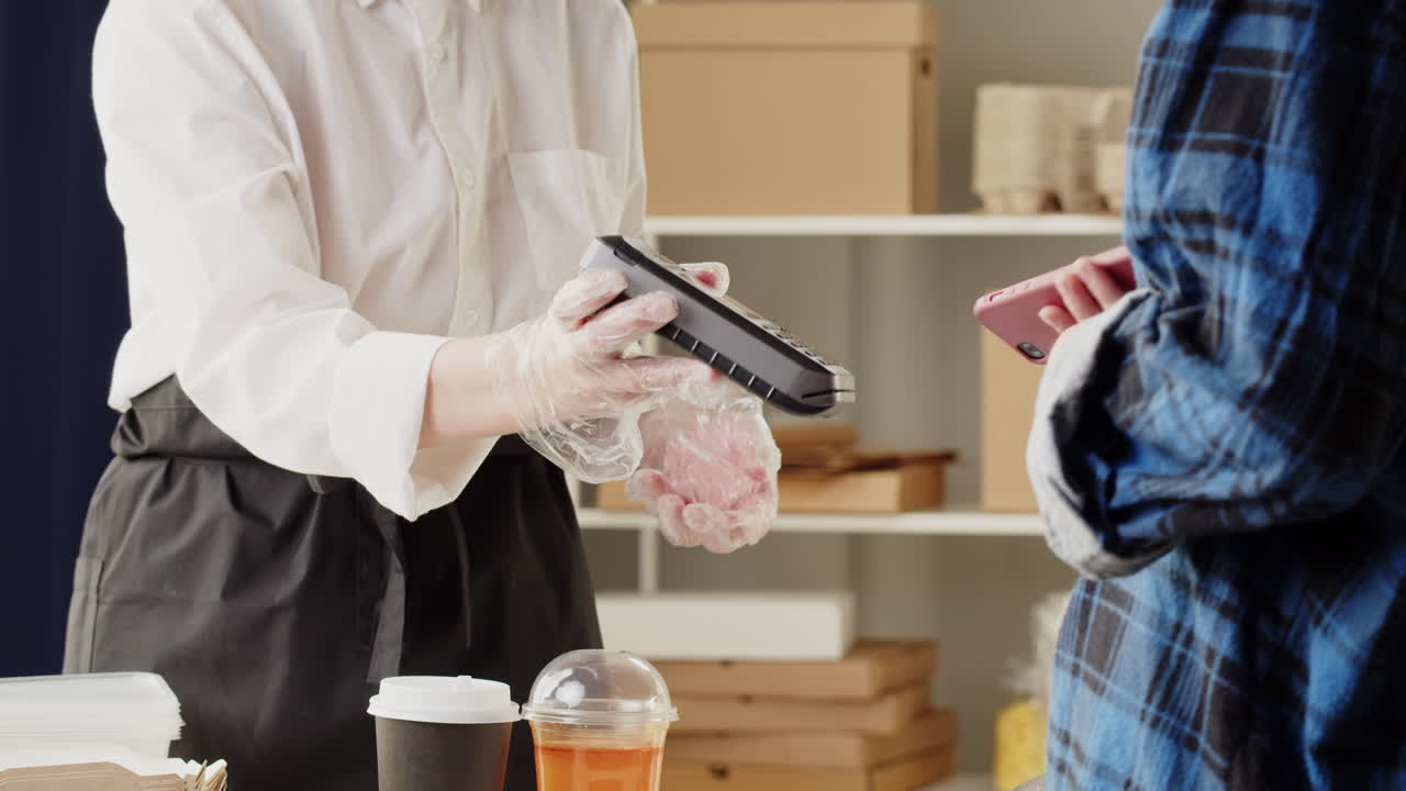 Barista Serves Drinks and Processes Contactless Payment for Customer
