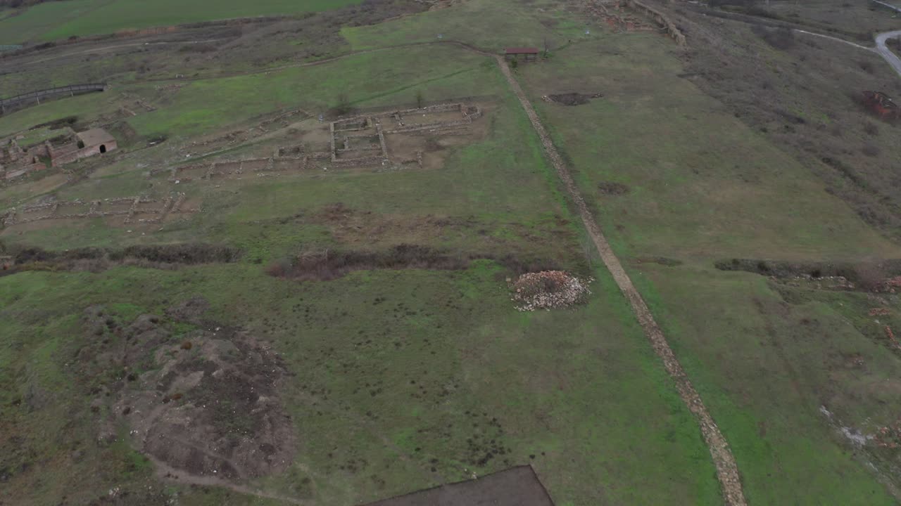 Bird's eye view of an abandoned ancient city of Kabile in Bulgaria, surround by vast green land