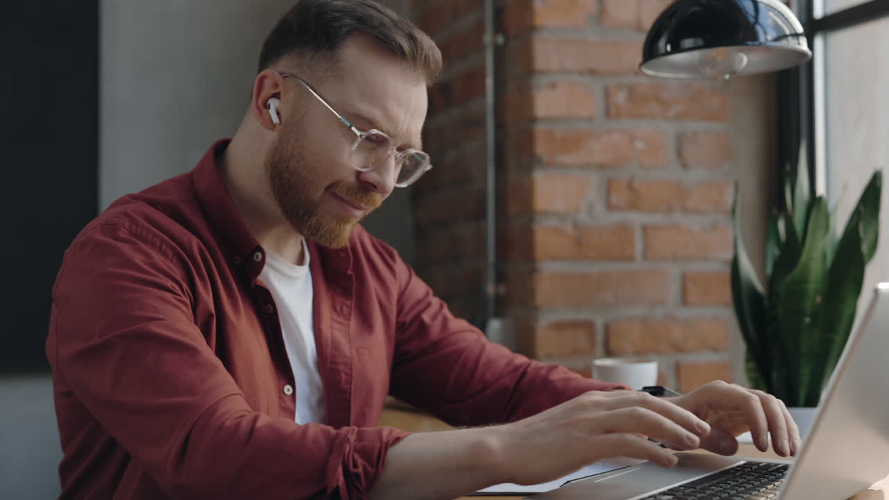 Man working at laptop experiencing cough and chest pain