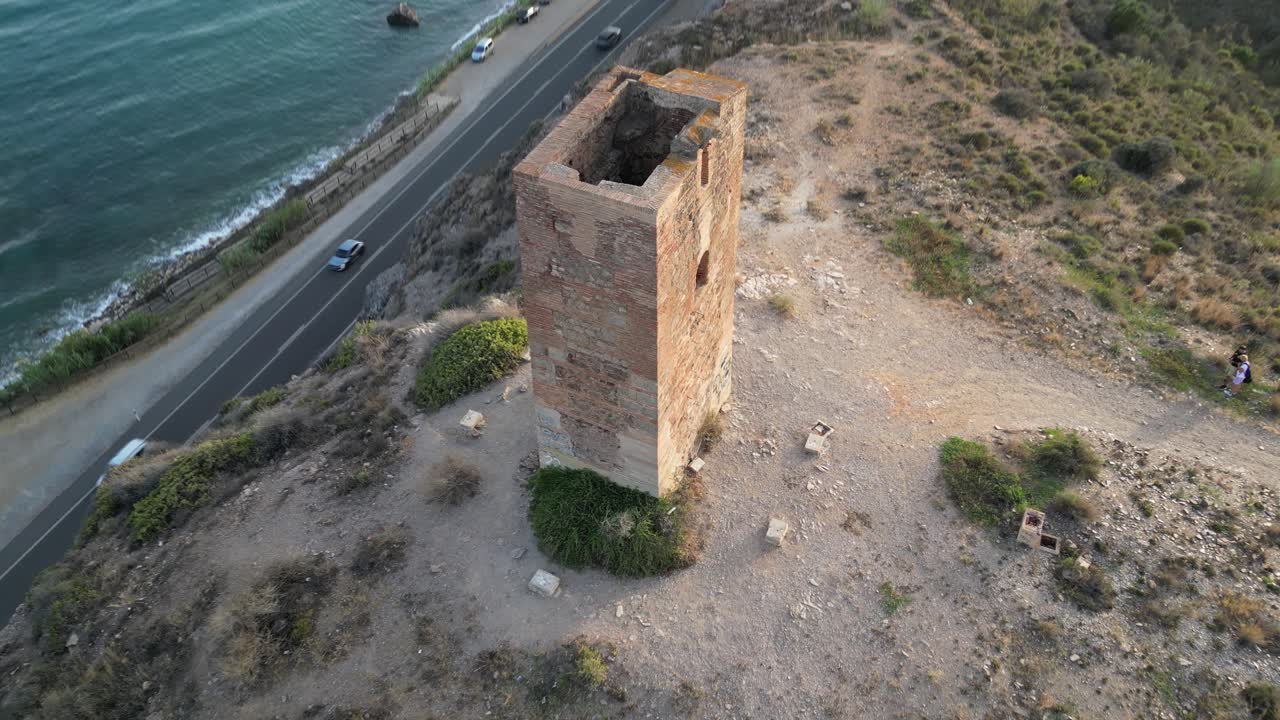 Experience the historic Tower of Jaral in Almayate Bajo from a mesmerizing drone's-eye view