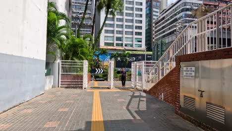people entering a park in urban hong kong