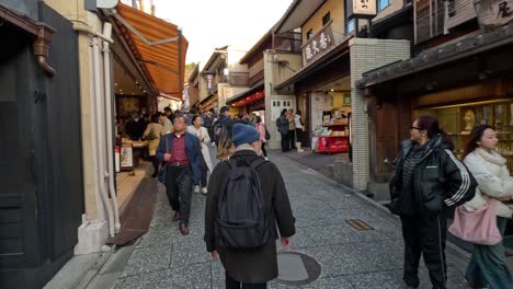 crowded outdoor market with diverse visitors and shops