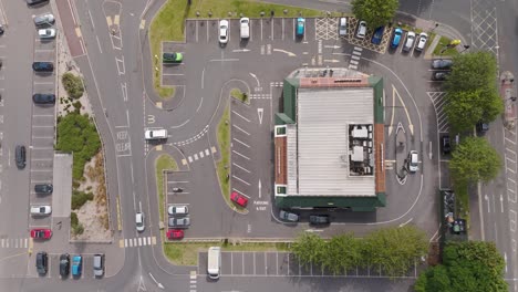 aerial view of a mcdonald's restaurant with drive-thru and parking lot
