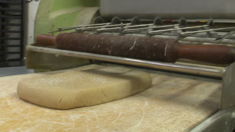 dough being processed in a commercial kitchen